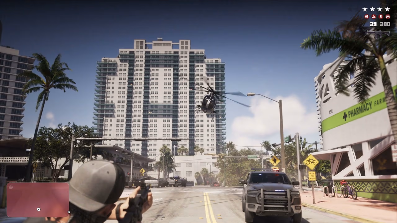 A nighttime vehicle pursuit with a four-star wanted level and police helicopter HUD in Rockstar's Extended Look
