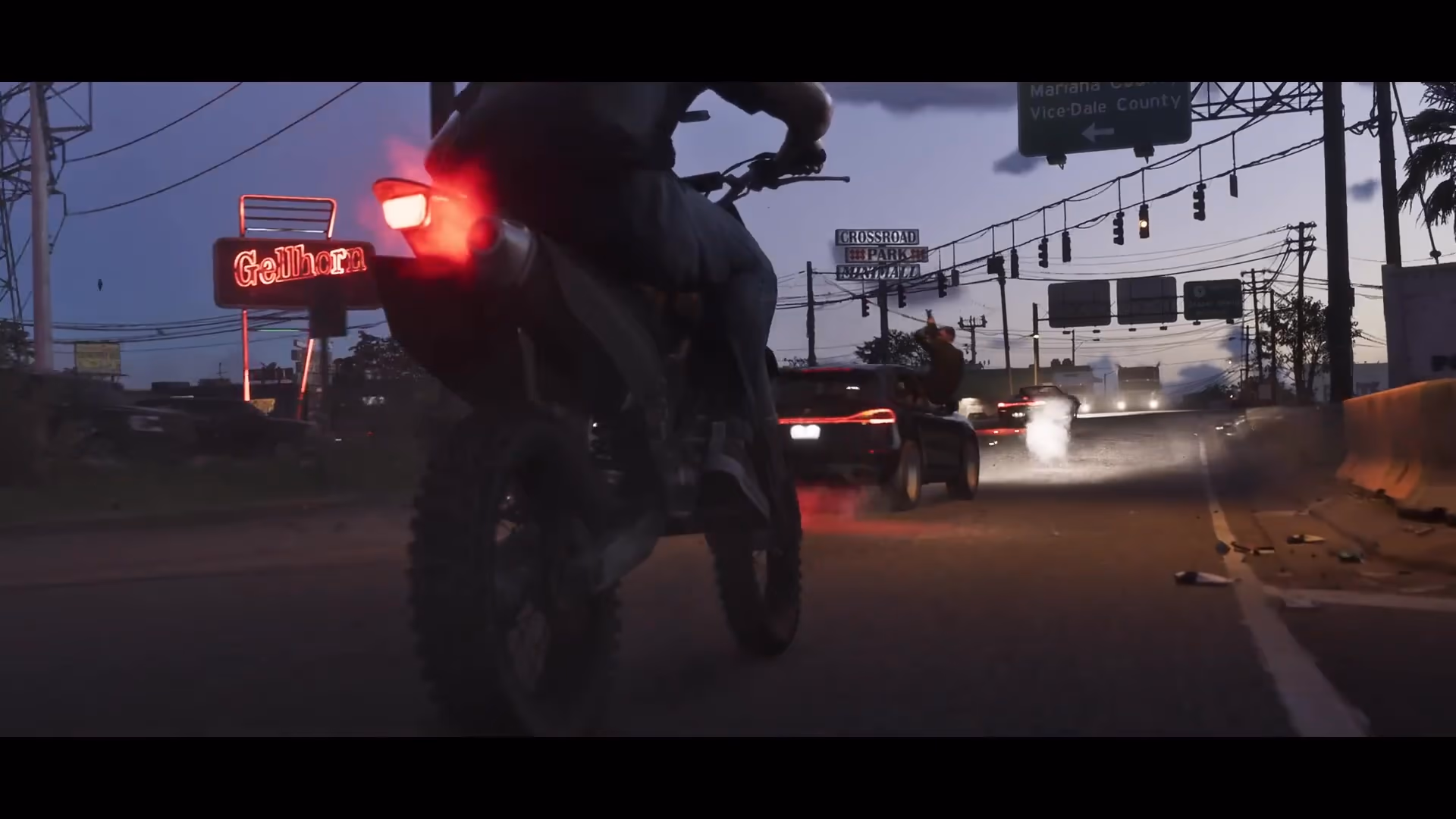 Motorcycle and sports cars moving through a Leonida intersection in official GTA 6 footage