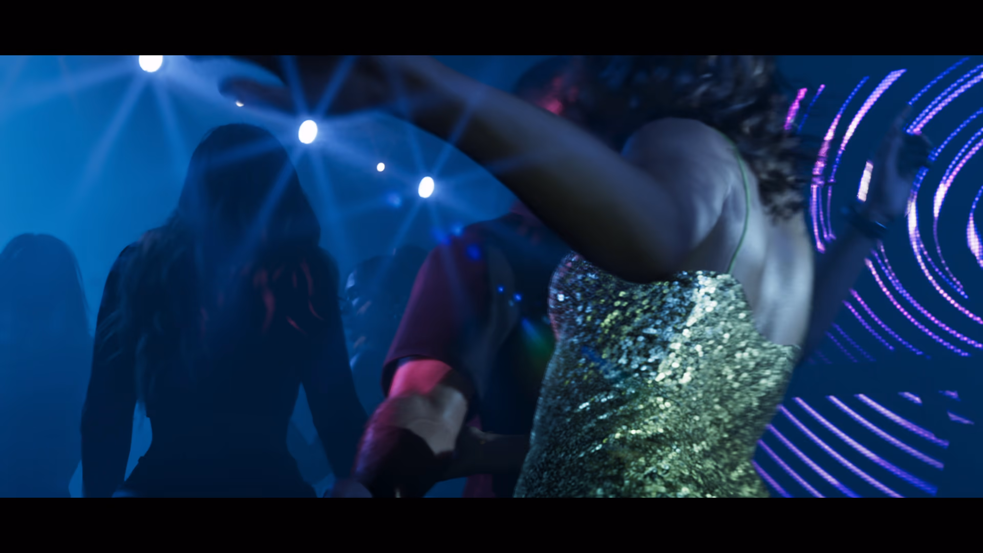 An unidentified performer dancing beneath Vice City nightclub lights in official GTA 6 footage