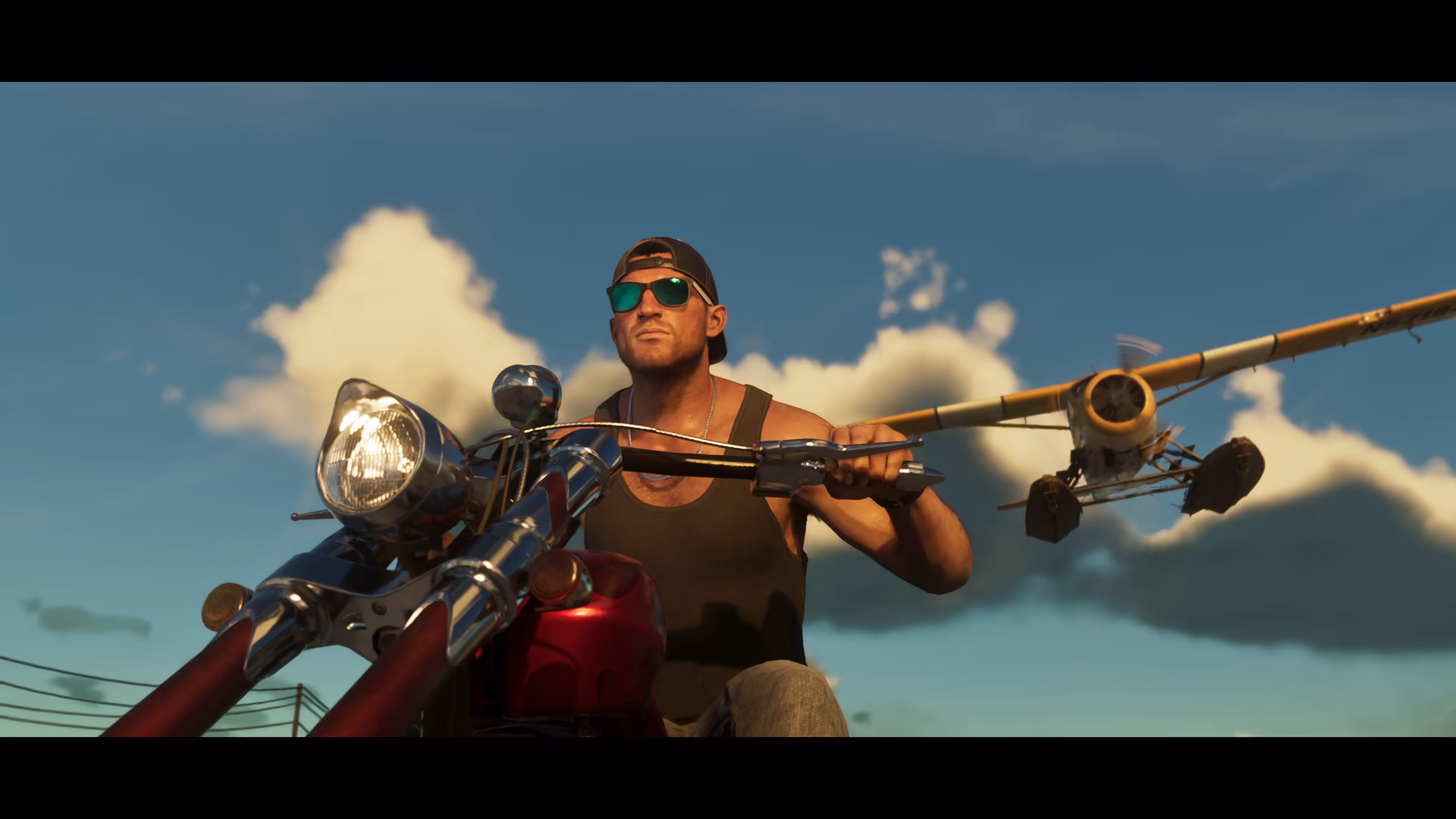 A street motorcycle riding beneath a twin-engine ultralight aircraft in official GTA 6 footage